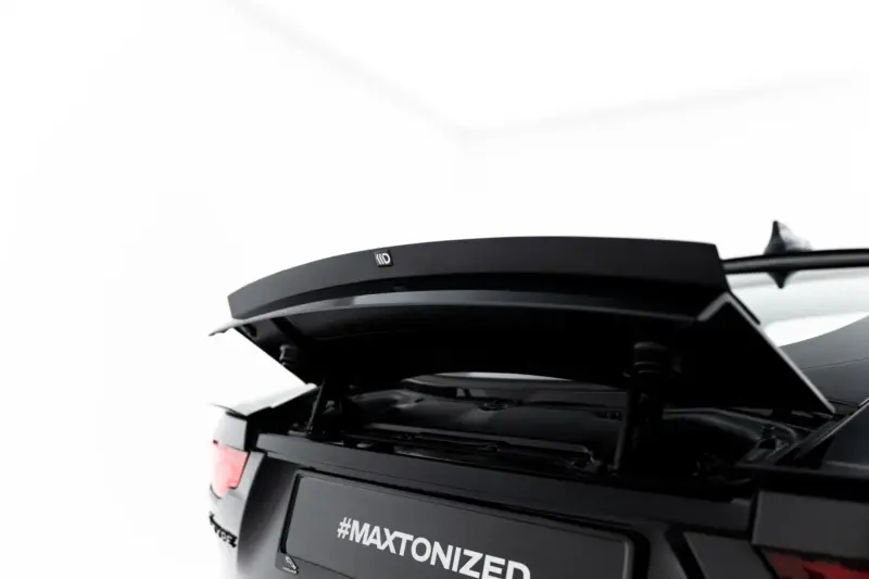 pol_po_Spoiler-Cap-Jaguar-F-Type-X152-Facelift-2-23971_2webp - OPSHOLDERS Rear view of a black SUV with its trunk open, displaying the hashtag #MAXTONIZED on the license area and a visible spoiler edge.