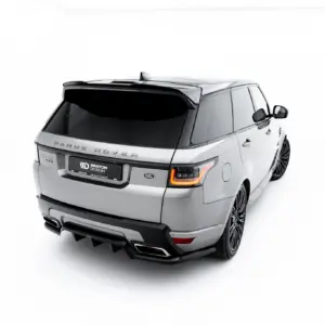 Rear three-quarter view of a silver Range Rover SUV in a white studio backdrop, showing the rear and right side