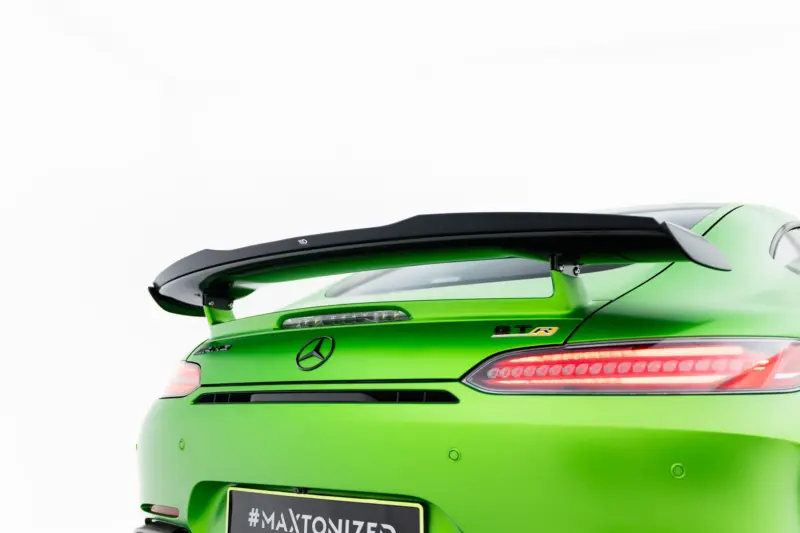 pol_po_Spoiler-Cap-Mercedes-AMG-GT-R-C190-Facelift-23891_2webp - OPSHOLDERS Green Mercedes-AMG sports car rear with prominent black spoiler and bright lime finish, partial tail light visible.