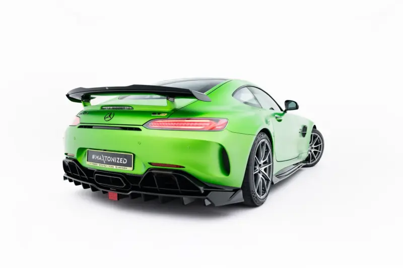 pol_po_Spoiler-Cap-Mercedes-AMG-GT-R-C190-Facelift-23891_3webp - OPSHOLDERS Bright green Mercedes sports car, rear three-quarters view with a large black rear wing, distinctive taillights, and an aggressive diffuser.