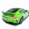 pol_po_Spoiler-Cap-Mercedes-AMG-GT-R-C190-Facelift-23891_4webp - OPSHOLDERS Rear-left view of a bright green Mercedes-AMG GT R with a black roof and carbon spoiler near the trunk.