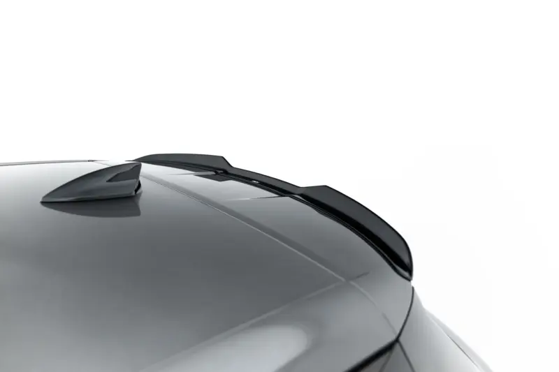 Close-up of a gray car hood with windshield wipers resting at the base of the windshield.