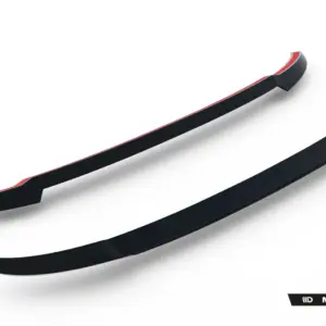 Close-up of two glossy black car aero splitters with red edging, angled across a white background; Maxton Design branding visible bottom right.
