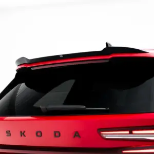 Red Skoda car rear with brand lettering and red taillights visible