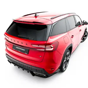 Red Skoda SUV viewed from the rear-right in a three-quarter angle, showing roof rails and alloy wheels on a white background.