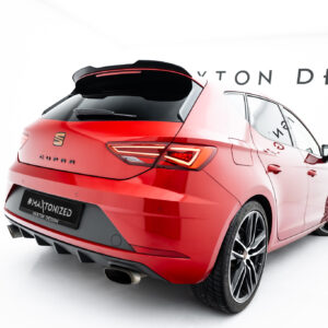 Red hatchback/SUV viewed from rear-left in a studio, showing taillights, rear bumper, and large alloy wheels; hashtag on plate reads “#MAXTONIZED.”