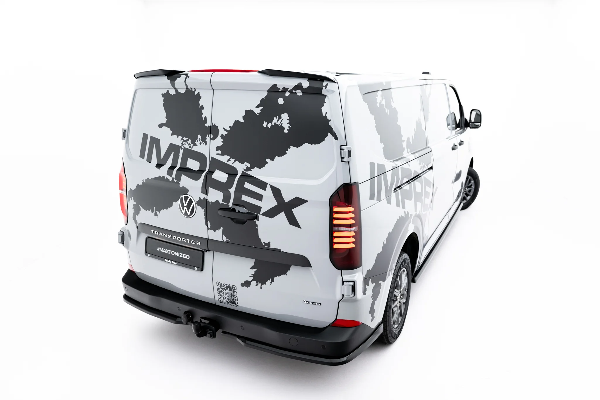 pol_po_Spoiler-Cap-Volkswagen-Transporter-T7-Ford-Transit-Custom-Mk2-23951_1webp - OPSHOLDERS White van with a gray world-map wrap and large bold text along the side and rear, viewed from the back-right corner.