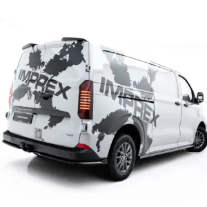 White delivery van with a gray world map graphic wrapping its sides, brand visible down the tailgate.