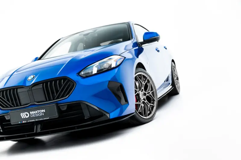 Blue BMW sports car angled to the left, featuring the front grille, headlight, and alloy wheel on a white background.