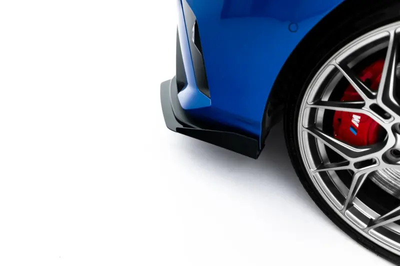 pol_po_Street-Pro-Front-Splitter-Flaps-BMW-2-M-Pack-M235i-Gran-Coupe-F74-23837_4webp - OPSHOLDERS Close-up of a blue car's front fender and wheel, featuring a silver alloy rim and red brake caliper.