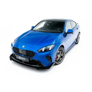 Blue sports car photographed from front-left angle on a white background, showcasing sleek grille and sporty design