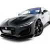 pol_po_Street-Pro-Front-Splitter-Flaps-Jaguar-F-Type-X152-Facelift-2-23974_8webp - OPSHOLDERS Black Jaguar sports car photographed from a low front-left angle, showing sleek hood and grille with Jaguar emblem