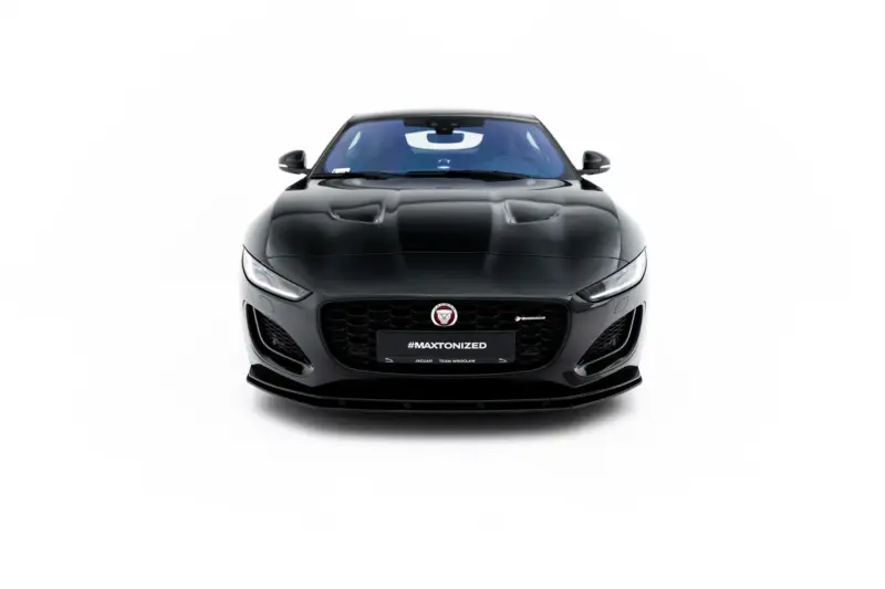 Front view of a black Jaguar sports car with a glossy hood and distinctive grille, featuring the #MAXTONIZED plate on the bumper.