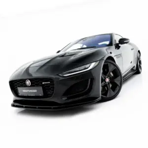 Jaguar F-Type sports car photographed from a low front-left angle against a white studio background.