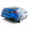 pol_po_Street-Pro-Rear-Diffuser-BMW-2-M-Pack-Gran-Coupe-F74-23846_2webp - OPSHOLDERS Rear three-quarter view of a blue BMW, showcasing the taillights and sporty rear diffuser/bumper details