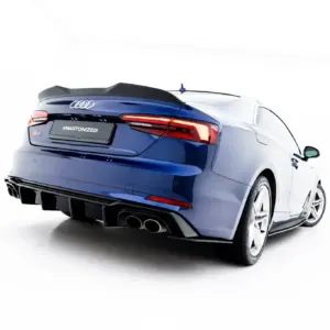 Rear view of a blue Audi S5 with a spoiler and quad exhausts; plate reads #MAXTONIZED