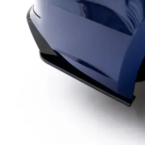 Close-up of a blue car's front bumper and tire, showing glossy painted surfaces and reflections.