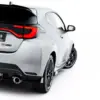 pol_po_Street-Pro-Rear-Side-Splitters-Flaps-Toyota-GR-Yaris-Mk4-Facelift-23792_5webp - OPSHOLDERS Rear three-quarter view of a silver GR Yaris with red taillights, visible exhaust, and a #MAXTONIZED license plate badge.