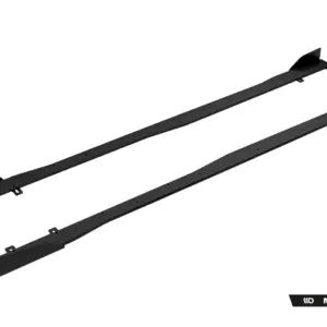 Pair of black long automotive undercarriage rails with mounting holes and end plates, shown diagonally on a white background.