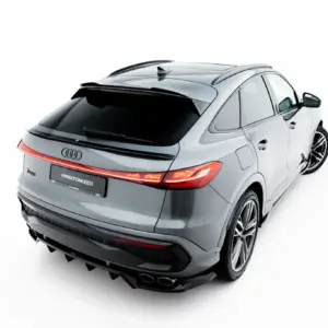 Rear three-quarter view of a silver Audi SUV with prominent taillights on a white studio background.