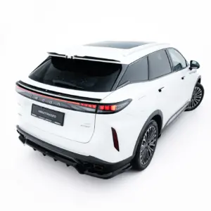 White SUV viewed from rear-right, showing a panoramic sunroof and sleek taillights.