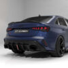 01_94ce4915-df24-4b22-a537-7d96b68906e0jpg - OPSHOLDERS Blue Audi sports sedan rear view with a carbon fiber diffuser, quad exhausts, and red taillights in a studio setting, badge reads CT CARBON.