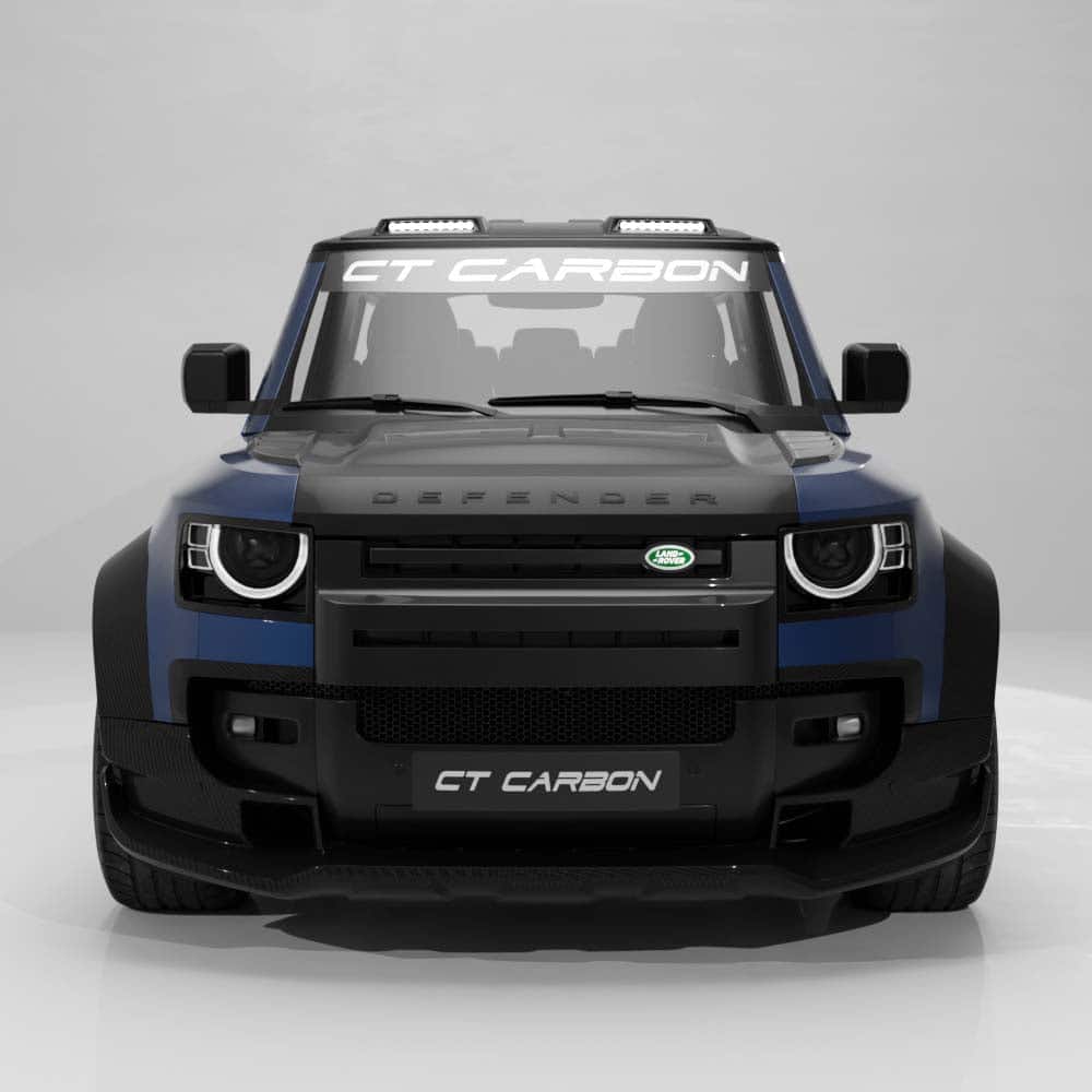 03_851ef592-2b84-4978-a693-b2d9081ea8cejpg - OPSHOLDERS Front view of a black-and-blue Land Rover Defender GT Carbon SUV with CT CARBON branding on the grille and windshield banner