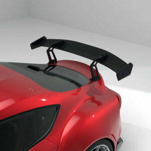 Red sports car with a large carbon fiber rear wing spoiler mounted on the trunk