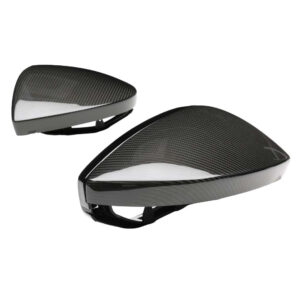 Carbon fiber bicycle helmet shells viewed from the side showing aerodynamic shape and internal mounting brackets