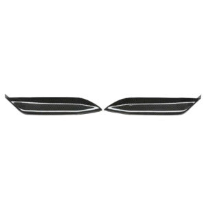 Pair of carbon fiber car vent/grille trim pieces laid flat, facing each other with white accent lines