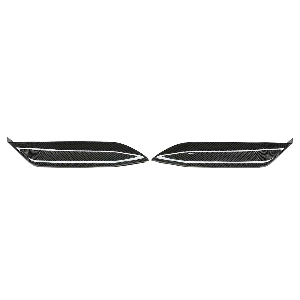 1_06a54cf9-14ef-44c8-b5db-ceb7a16f0ebfjpg - OPSHOLDERS Pair of carbon fiber car vent/grille trim pieces laid flat, facing each other with white accent lines