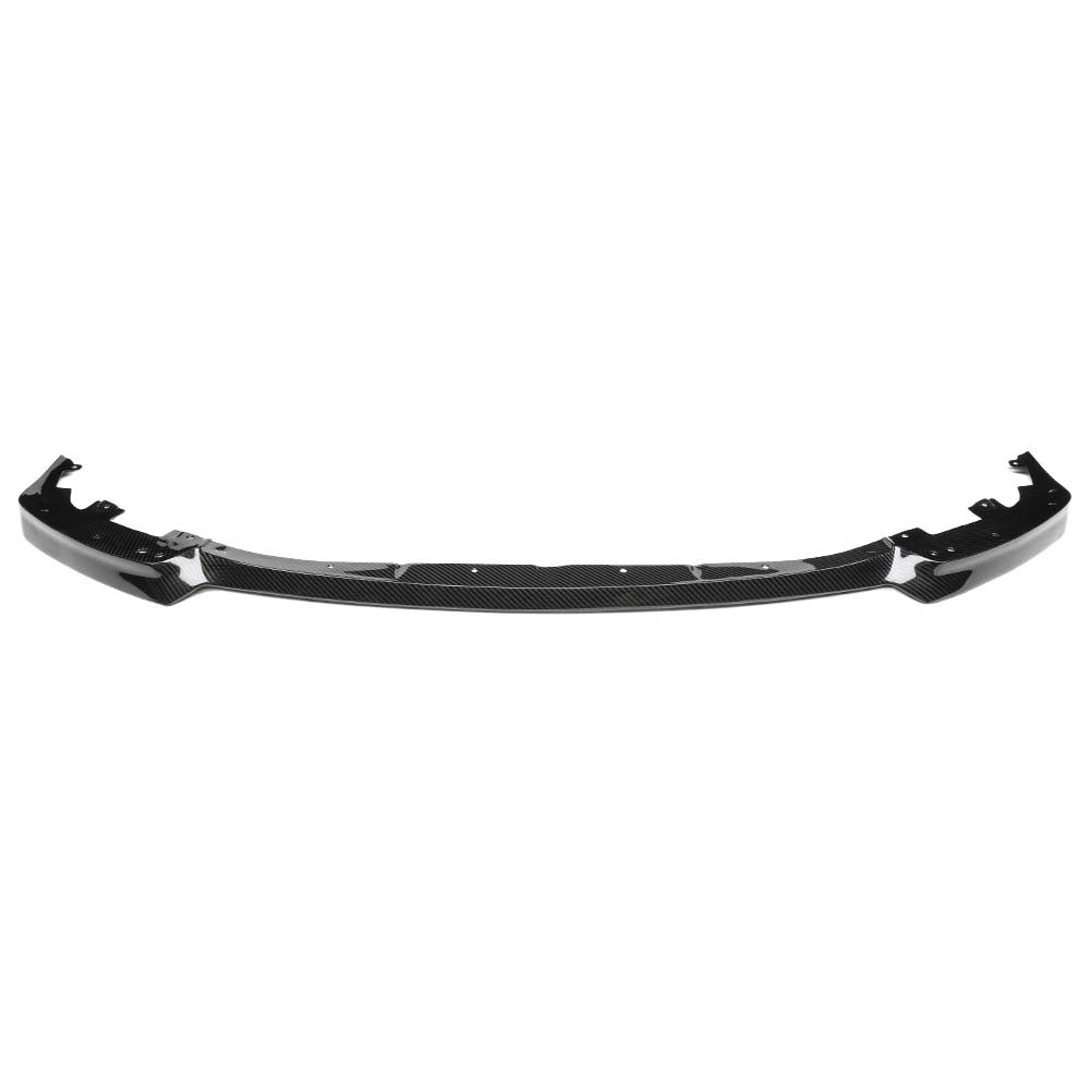 1_50524292-424c-4c9c-8584-f3dd2d44010ajpg - OPSHOLDERS Carbon fiber front bumper lip/spoiler extends along a curved lower edge of a car.