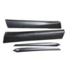 Carbon fiber car body trim pieces in various lengths, likely side skirts and decorative accents.
