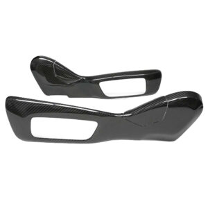 Pair of black carbon-fiber interior trim panels with large rectangular cutouts, likely for a car.