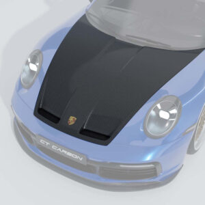 Front view of a blue sports car with a large carbon fiber hood and Porsche emblem, sport bumper and carbon lip spoiler (CT CARBON).