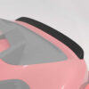 22_1ae5526d-55d1-4749-a928-274b94b7e034jpg - OPSHOLDERS Close-up of a pink sports car rear with a black carbon fiber spoiler surface