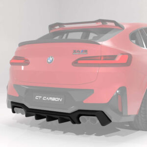 Rear view of a pink BMW with a GT Carbon rear bumper and diffuser, sporty styling visible.