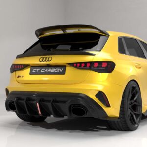 Rear view of a yellow Audi hatchback with a carbon fiber rear diffuser, spoiler, and quad exhausts.
