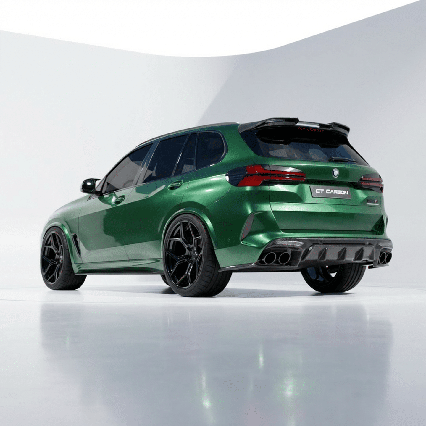 27_ec437851-a978-47cd-a597-bcac69995becpng - OPSHOLDERS Rear three-quarter view of a green BMW GT Carbon SUV with large black wheels and quad exhausts in a studio setting
