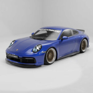 Blue Porsche 911 GT Carbon sports car with bronze mesh wheels in a white studio setting