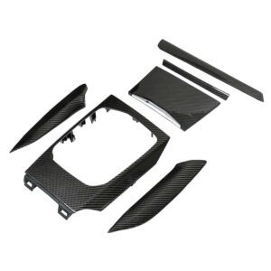 Set of carbon fiber interior trim panels for a car, including dashboard surround, center console pieces, and small accents.