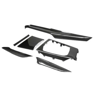 Carbon fiber car interior trim kit with multiple panels and center console pieces laid out
