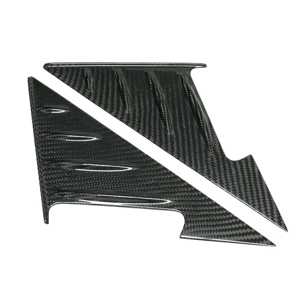 2_ce394f83-0d0d-48e0-a8dc-ac1642067c53jpg - OPSHOLDERS Carbon fiber automotive interior trim panel with an angular shape and cutouts