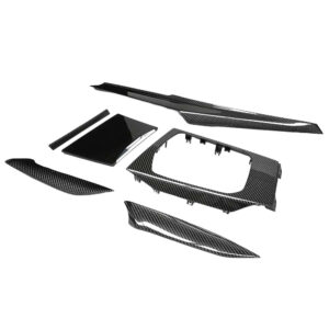 Carbon fiber car interior trim kit with multiple panels and bezels laid out.