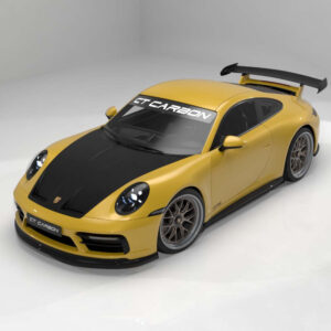 Yellow Porsche race car with black carbon fiber hood and large rear wing in a studio setting, GT Carbon branding on windshield banner.