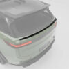 43jpg - OPSHOLDERS Rear three-quarter view of a pale green SUV with a carbon-fiber spoiler, distinctive taillights, and 'RANGE ROVER' lettering.