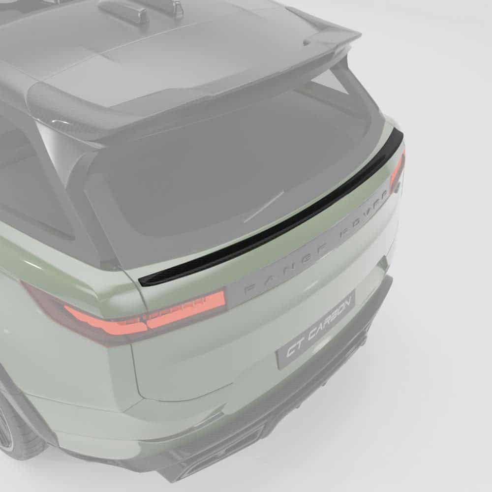 43jpg - OPSHOLDERS Rear three-quarter view of a pale green SUV with a carbon-fiber spoiler, distinctive taillights, and 'RANGE ROVER' lettering.