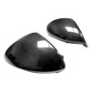 Pair of glossy black carbon-fiber motorcycle fairing panels, curved aerodynamic shells.