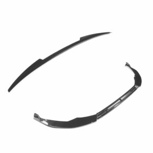 Close-up of a black sunglasses frame curving diagonally across a white background, showing the lens rim and temple region