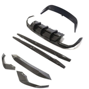 Carbon fiber car body kit with front splitter, side skirts, and rear diffuser laid out separately for assembly.
